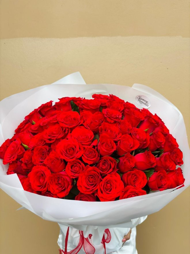 Ruby Royal is a luxurious bouquet of premium red roses, wrapped in white with satin ribbon. A majestic expression of deep love and passion.