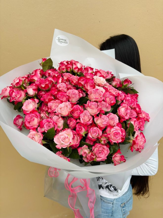 A lush bouquet of vibrant pink roses, ideal for romantic and celebratory moments.