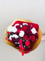 Nina bouquet with red and white roses, dark burgundy chrysanthemums, and bright pink carnations wrapped in golden paper with burgundy accent