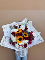 Sunflower, red rose, and white chrysanthemum bouquet wrapped in paper with gold “Every Day I Love You” text.