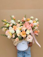 Peach and white roses with carnations in a round white box