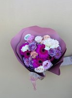 Zina bouquet featuring magenta gerberas, purple and pink roses, and purple chrysanthemums wrapped in elegant purple paper