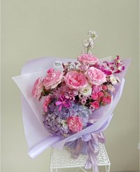 Lavender Dream bouquet with pink roses, hydrangeas, orchids, and carnations, perfect for romantic gestures in Phuket flowers arrangements.